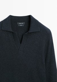 Dark navy cotton sweater with a ribbed texture, featuring a V-neck and a collared design. Label reads "Massimo Dutti."