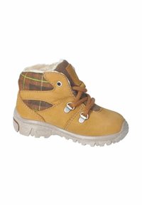Botas de cuero marrón claro con un panel de tela a cuadros marrón, forro de piel sintética blanca, cordones marrones y suela de goma con patrones de agarre.