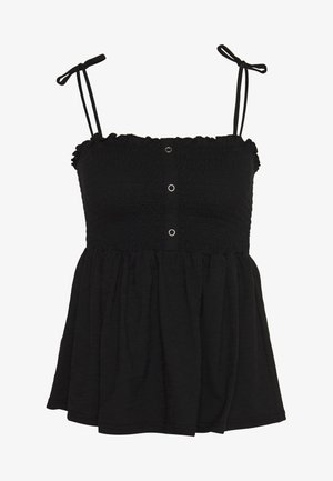 Haut sans manches noir à smocks avec de fines bretelles réglables et trois petits œillets ronds en métal au centre devant.