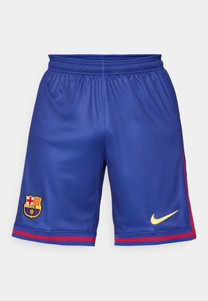 Športové šortky FC Barcelona v modrom polyesteri, s veľkým zlatým logom Nike a klubovým erbom, s červenými bočnými pruhmi. Elastický pás pre pohodlie.