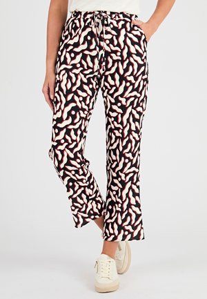 Pantaloni neri con un accattivante motivo astratto nei toni crema e rosso, dal taglio rilassato, con vita regolabile e una sottile texture.