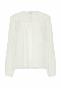 Blusa bianca a maniche lunghe con scollatura arricciata e fiocco, caratterizzata da una texture a pois e tessuto semi-trasparente. Taglio dritto all'orlo.