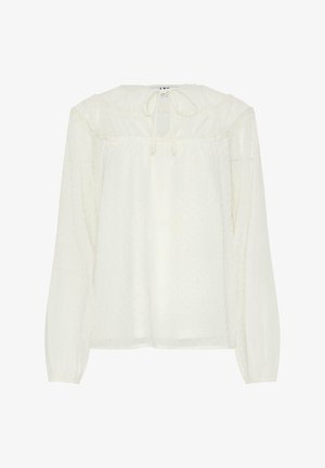 Valkoinen, pitkähihaisista puseroista, joissa on kerätty pääntie ja solmu, joka on varustettu pistekuviolla ja puoliksi läpikuultavalla kankaalla. Suora leikkaus helman kohdalla.