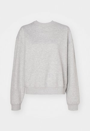 Light gray sweatshirt with a classic crew neck, dropped shoulders, and ribbed cuffs and hem. Soft texture and relaxed fit.