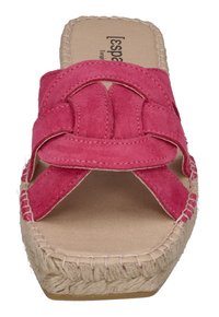 Pink suede slide sandal with cross straps, textured surface, natural fiber sole, and stitched detailing along the edge.