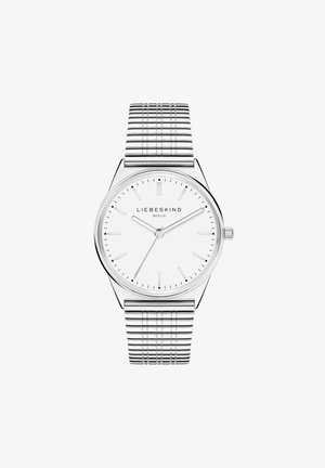 Sølv metalur ur med et tyndt, rundt urkasse og en hvid urskive. Har minimalistiske timemarker og et tekstureret mesh rem.