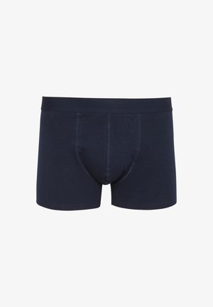 Tumed sinine puuvillane bokserite aluspesu, mis istub mugavalt, omab pehmet vöökohta ja kontrastset õmblusdetaili. Ilma mustrite või graafikata.