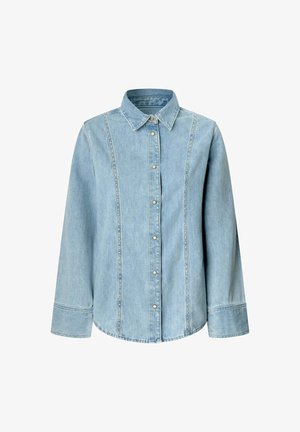 Hele sinine denimist särgiga, pikad varrukad, kaelus, nööbid ees ja vertikaalsed õmblused. Omab klassikalist denimitekstiuri ja sobivust.