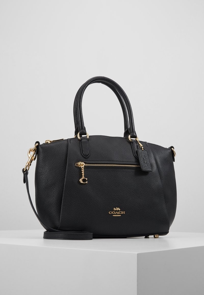 Borsa a tracolla in pelle nera con finitura testurizzata, manici superiori doppi, accessori in oro e una tasca con zip sul davanti. Inclusa tracolla removibile.