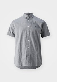 Kortärmad skjorta med knappar i ljusgrått tyg med spetsig krage, med en bröstlogo och rundad fåll längst ned.