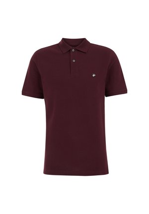 Polo bordeaux avec un col, patte de boutonnage à deux boutons, manches courtes et un petit logo brodé sur la poitrine gauche. Matière en coton.