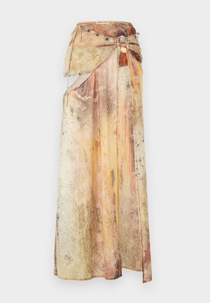 Long, draped skirt made of layered, textured fabric in warm tones of yellow, orange, and brown. Features a decorative beaded belt.