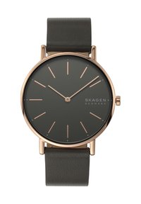 Runde Skagen-Uhr mit einem dunkelgrauen Zifferblatt, rosegoldenen Markierungen und einem dunklen Lederarmband. Minimalistisches Design mit schlanken Linien und ohne Zahlen.