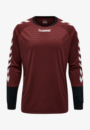 Bordeaux kleurig sportshirt met lange mouwen en een gestructureerd patroon, zwarte accenten op de mouwen en witte chevrons op de schouders. Hummel-logo op de voorkant.