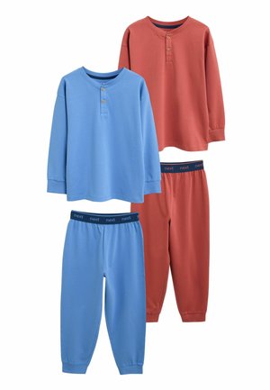 Two sets of long-sleeve tops and pants, one in blue and one in rust orange, with buttoned necklines and elastic waistbands labeled "next."