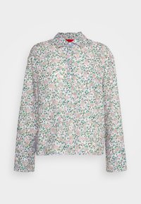 Chemise à boutons à motifs floraux avec manches longues. Présente un fond blanc et des motifs floraux complexes en rose, vert et violet. Design classique avec col.