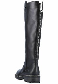 Bottes noires en cuir hautes avec une fermeture éclair sur le côté, finition texturée et semelle robuste. Présente un détail cousu le long de la semelle.