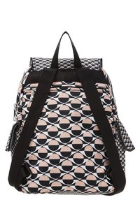 Sac à dos avec un motif géométrique de cercles noirs et roses, fabriqué en tissu, doté de bretelles réglables et d'une poche zippée à l'avant.