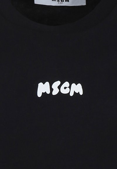 T-shirt nera con un logo bianco contenente le lettere "MSCM" in un carattere giocoso e arrotondato. Realizzata in tessuto morbido con design a girocollo.