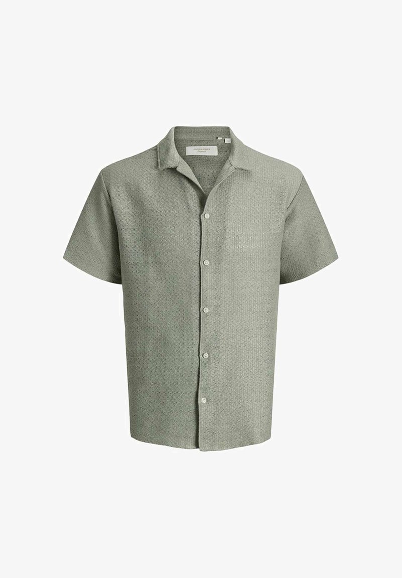 Chemise à manches courtes gris clair texturée avec boutons et col, présentée sur fond blanc.