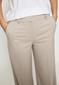 Minus ELVERA MID WAIST  - Hlače - string grey