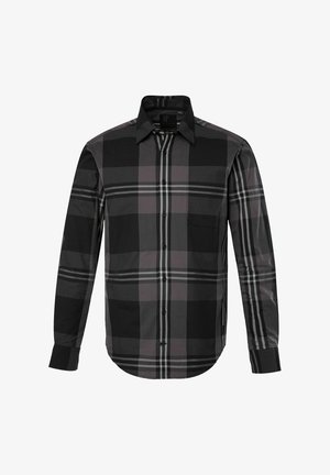 Chemise à carreaux noir et gris avec des manches longues, bouton sur le devant, col, poche poitrine unique et ourlet arrondi. Fabriquée en tissu léger.