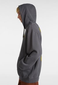 Gray hoodie featuring a drawstring hood, front pocket, and yellow logo details; made from soft fabric with a relaxed fit.