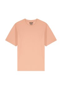 T-shirt in cotone color pesco, collo girocollo, maniche corte, texture liscia, design minimale, con etichetta del marchio all'interno del colletto.