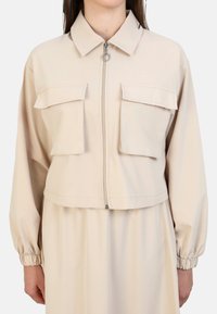Modanisa BENIN SET - Veste légère - beige