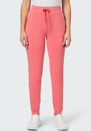 Helle rosa Jogginghosen aus weichem Stoff, mit einem elastischen Bund und Kordelzug, seitlichen Taschen und schmal zulaufenden Beinen.