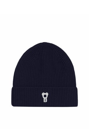 Bonnet en maille côtelée bleu marine avec un revers plié et un petit logo blanc brodé sur le bord avant.