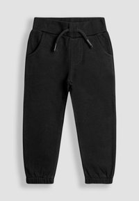 Pantalones de chándal negros fabricados en un tejido suave y texturizado, con una cinturilla elástica con cordón y tobillos ajustados. Incluye dos bolsillos laterales.