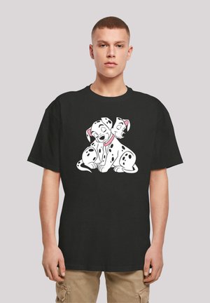 Black cotton t-shirt featuring a graphic of three cartoon Dalmatians with spots, smiling and stacked, in white and pink.