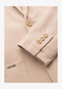 Sélectionné, beige