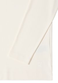 Long-sleeve cream shirt made of soft fabric, featuring a fitted design and a small "PURE" logo on the hem. Smooth texture, no patterns.