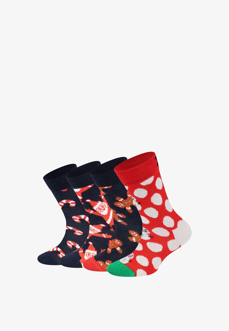 Four pairs of colorful socks: two with navy backgrounds featuring Christmas characters, and two red with white polka dots.
