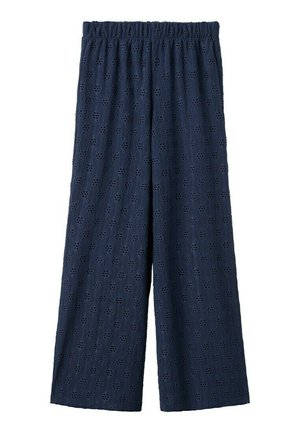 Pantalon large bleu marine avec taille élastique et motif floral ajouré sur tout le tissu.