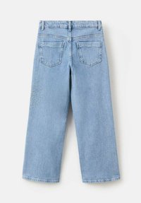Light blue denim wide-leg jeans featuring a mid-rise waist, two back pockets, and embellishments on the left thigh.