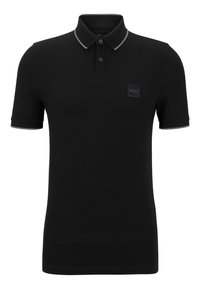 Czarny polo z krótkimi rękawami, z szarym kołnierzykiem i akcentami na rękawach, zapinany na dwa guziki, z małą czarną metką na piersi.