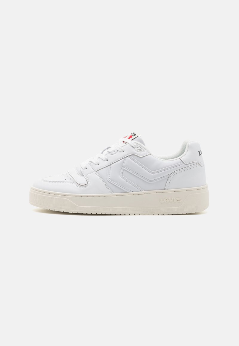 White sneaker made of synthetic leather with a textured surface, featuring a flat sole, lace-up closure, and subtle branding.