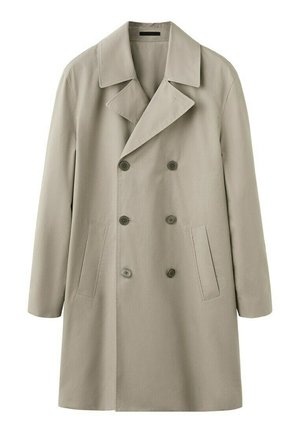 Dvoredni bež baloner s širokim reverima, šest dugmadi i dva uska okomita džepa na svakoj strani.