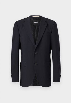 Blazer azul marino hecho de tejido texturizado, con cierre de dos botones, solapas con muesca y dos bolsillos frontales. Interior forrado con un patrón.
