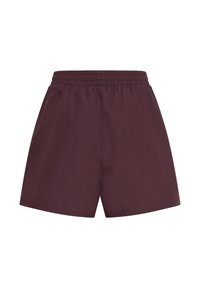 Shorts de sport marron avec taille élastique et coupe ample, conçus pour le confort et une utilisation décontractée ou sportive.