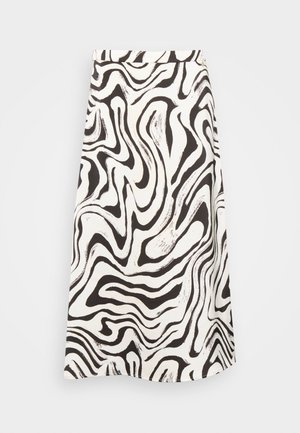 Spódnica założona wysoko w talii, sięgająca do kolan, z czarno-białym abstrakcyjnym wzorem falistych pasków i gładką teksturą tkaniny.