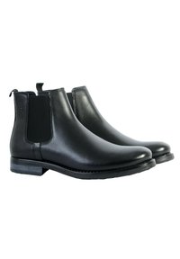 Stivali Chelsea in pelle nera con pannelli elastici laterali, punta arrotondata, design minimalista e tacco basso, dotati di linguette sul retro.