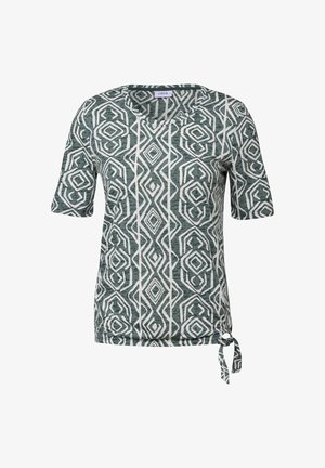 Kurzärmliges Oberteil mit einem geometrischen Muster in Türkis und Weiß, aus weichem Stoff, mit einem Bindedetail am Saum.