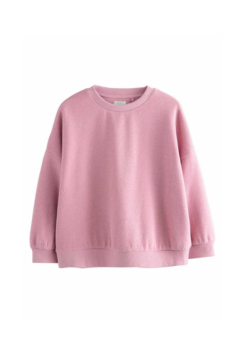 Sweatshirt rose avec un col rond, des manches longues et des poignets côtelés. Tissu doux avec une finition texturée ; coupe décontractée et épaules légèrement tombantes.