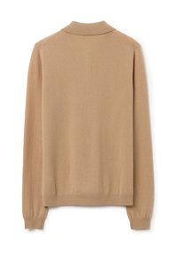 Beige trui met een zachte textuur, voorzien van een omklapbare kraag en geribbelde manchetten. Het ontwerp is eenvoudig en minimalistisch, met een effen kleur.