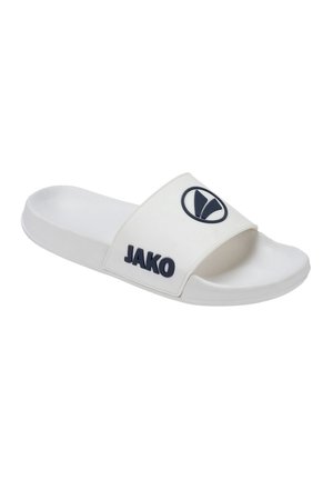 White slide sandal made of synthetic material, featuring a wide strap with a navy logo and black lettering. Flat sole, smooth texture.