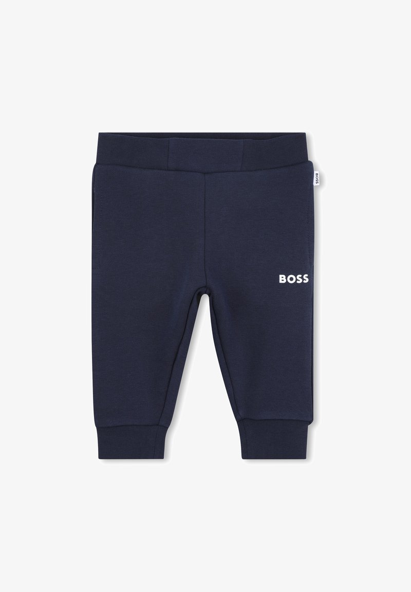 Pantalons de survêtement bleu marine en tissu texturé, avec une taille élastique et le logo "BOSS" en blanc à l'avant.